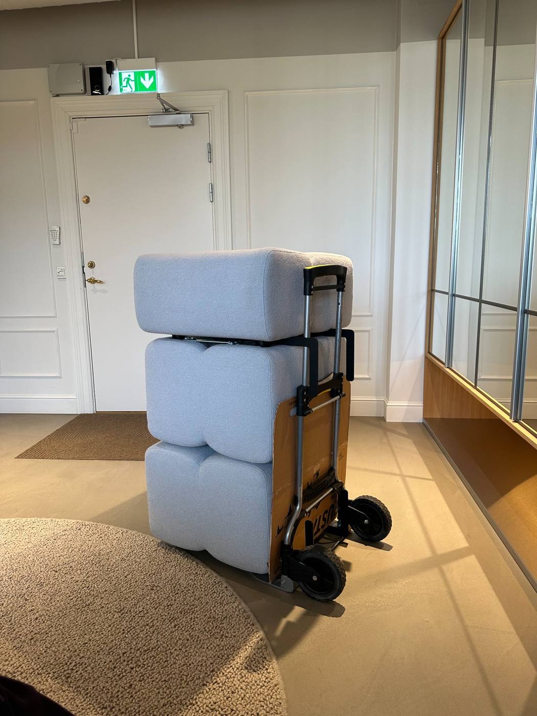 Three KEEEP modules stacked on a hand truck — compact enough for ordinary doors and stairs.